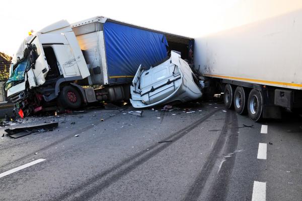 truck accident involving 2 trucks and another vehicle