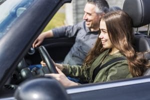 Teen driving with parent