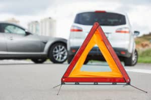 Road warning triangle sign in focus