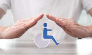 Disabled person protected by hands Concept of disability insurance