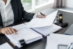Lawyer going over paperwork to file a personal injury claim