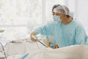 Surgeons operating on patient